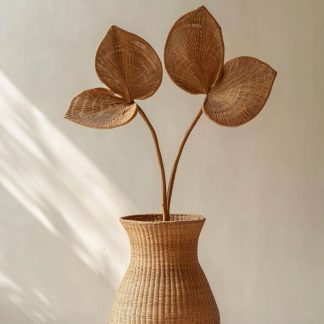 A beautiful decorative item that pairs with real flowers for the living room dining table
